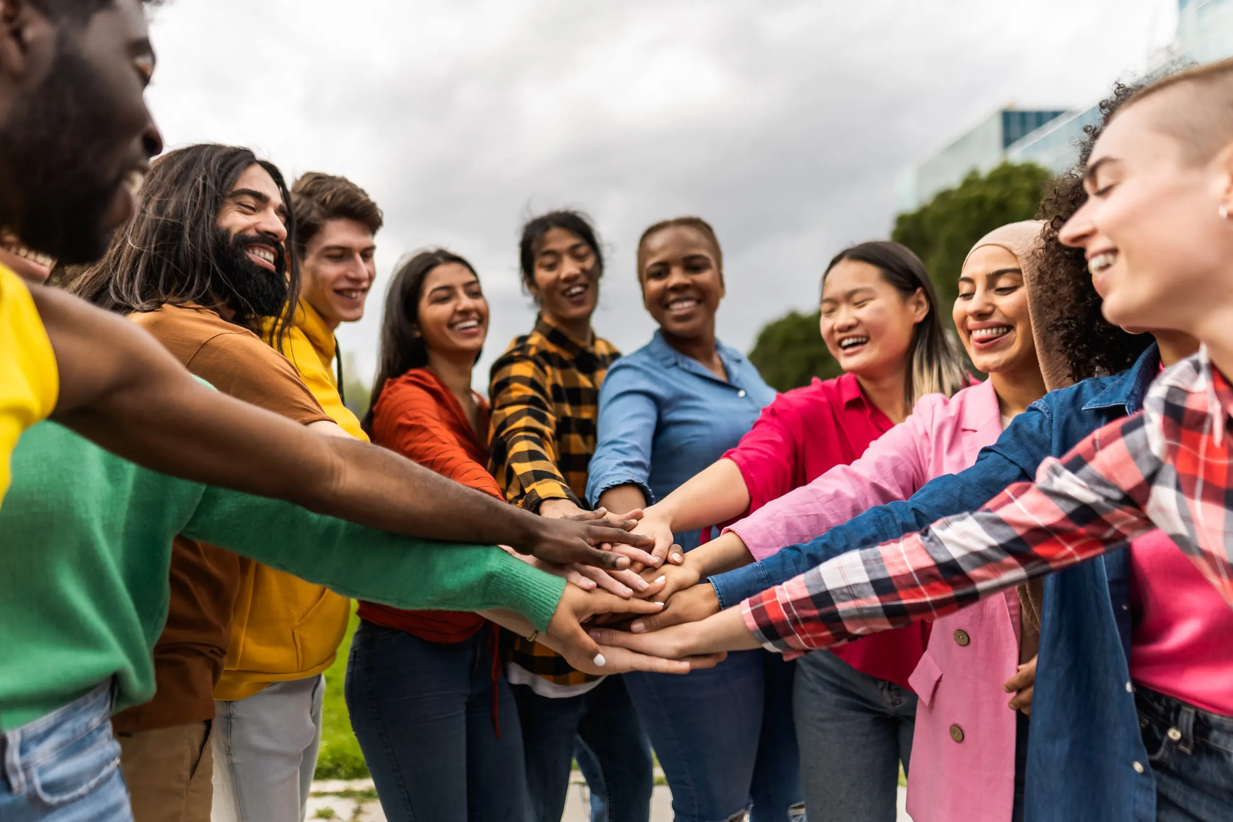 People stacking hands together
